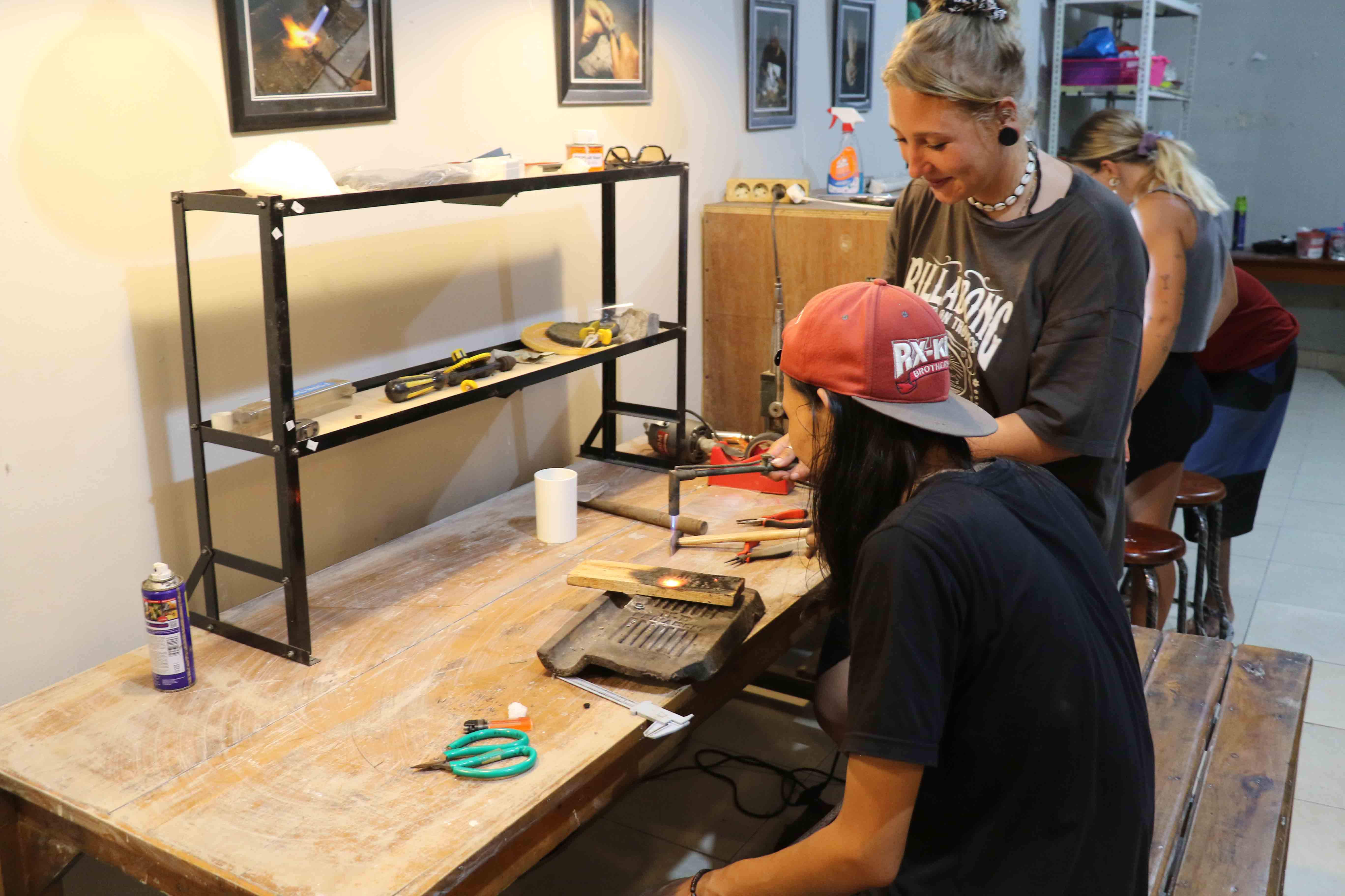 Guest and instructor working at the workshop bench